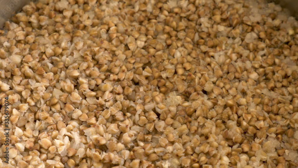 buckwheat porridge cooking in metal pan buckwheat porridge cooking in metal pan
