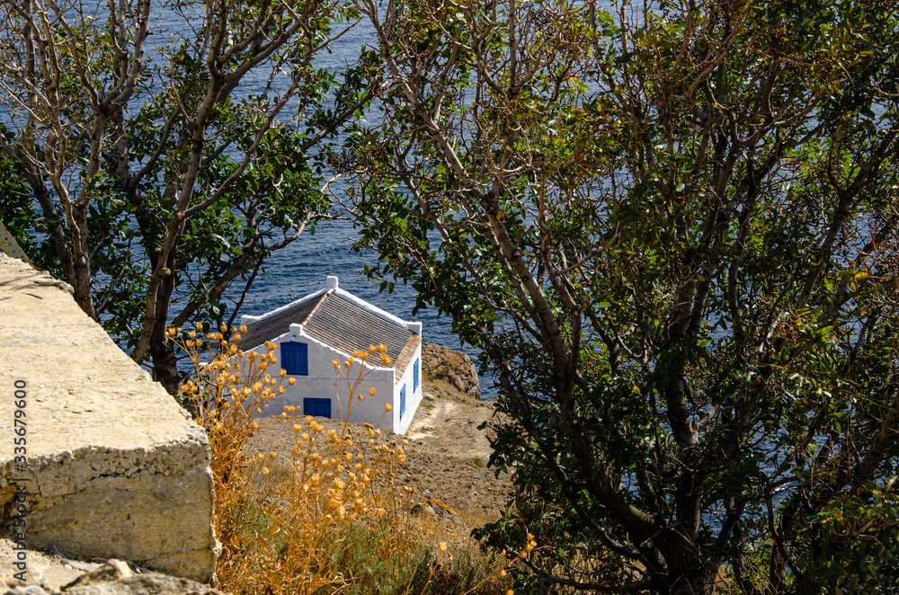 House by the sea in the mountains, sunny day. House by the sea in the mountains, sunny day.