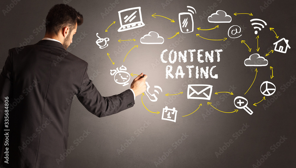 businessman drawing social media icons with CONTENT RATING inscription, new media concept businessman drawing social media icons with CONTENT RATING inscription, new media concept