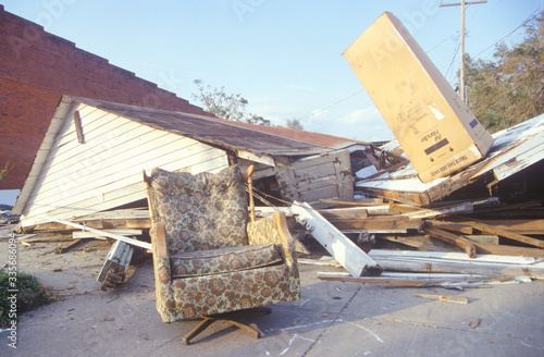 An armchair and a gabled roof in one piece while the rest of a Jeanerette, Louisiana, house lies in ruins after Hurricane Andrew, 1992