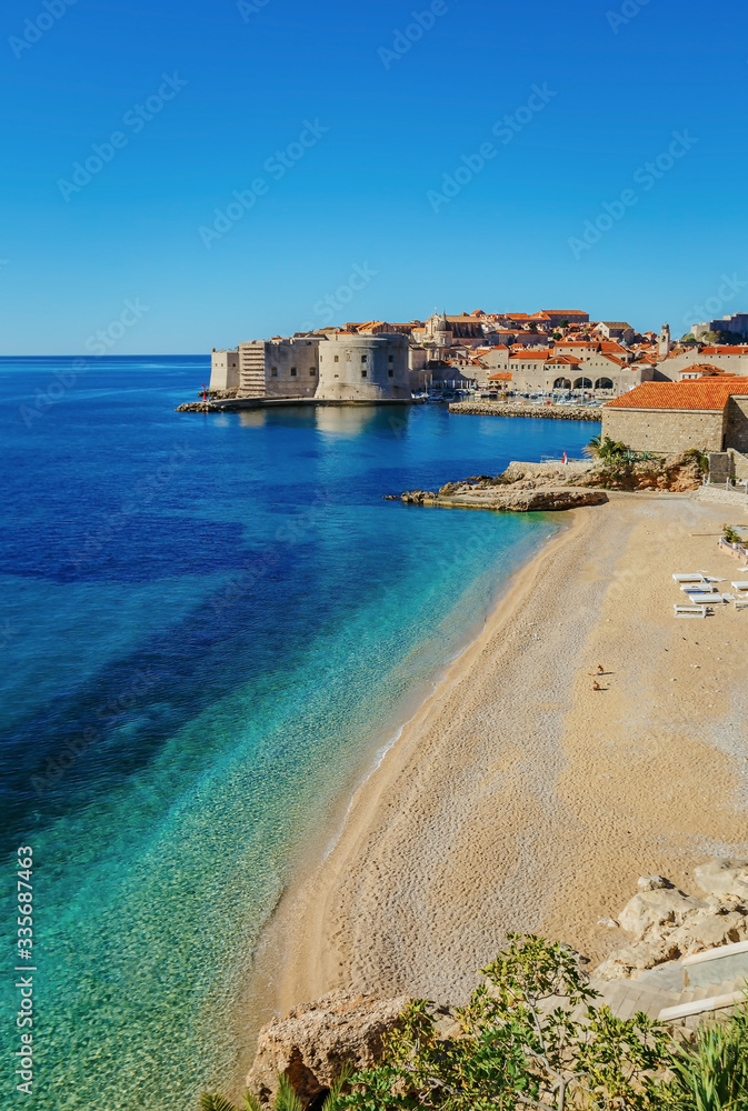 Beautiful landscape view of old town Dubrovnik, sand beach and blue Adriatic sea