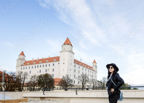 Tourist woman and view of Bratislava castle 