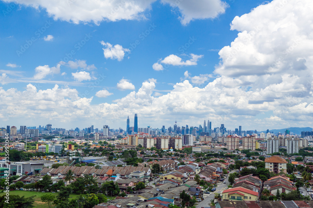 Fototapeta premium View of cumulus clouds over down town Kuala Lumpur, Malaysia.