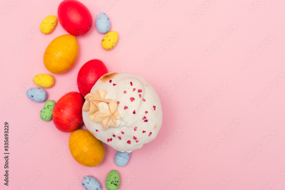 Easter cake on a pink background next to colored quail pastel and chicken eggs. Easter gift card Easter cake on a pink background next to colored quail pastel and chicken eggs. Easter gift card