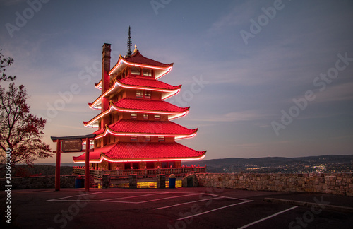 Reading Pagoda glows red with lights on in the pre-dawn light