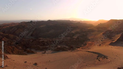 Aerial view of dramatic landscape caused by erosion at the Moon Valley (Spanish: Valle de la Luna ) at sunset in the Atacama Desert, Chile, South America. photo