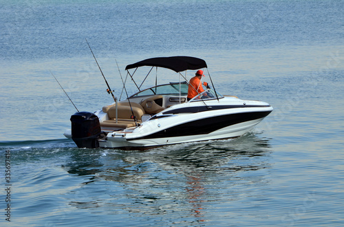 Fotografija Upscale motor boat powered by a single outboard engine.