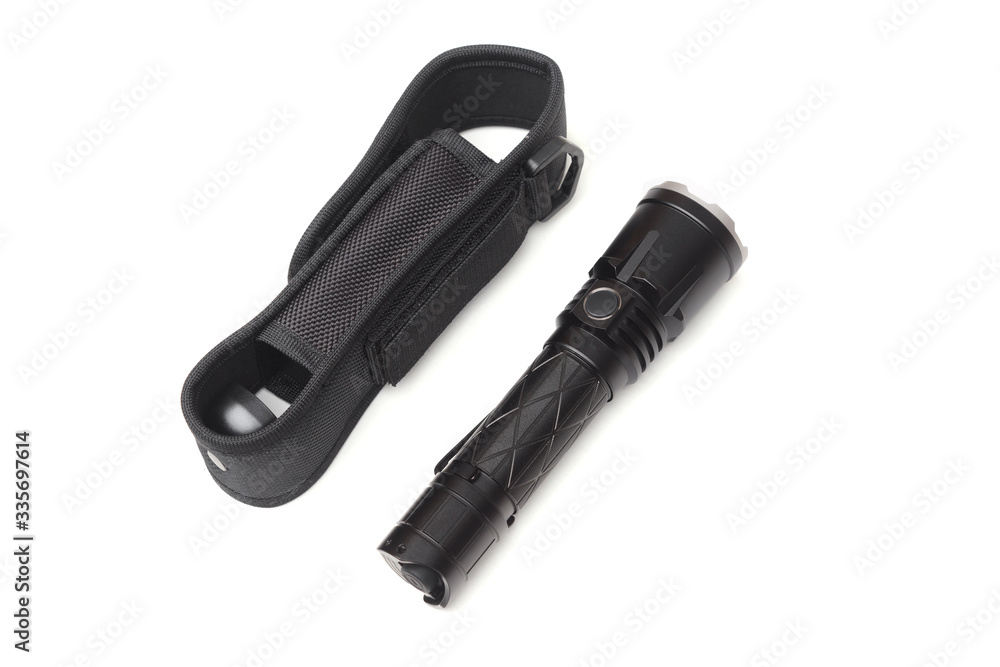 A flashlight with a holster isolated on white background A flashlight with a holster isolated on white background