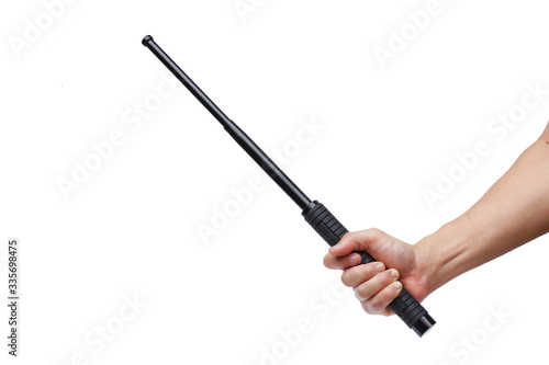 Hand holding a baton isolated on white background photo