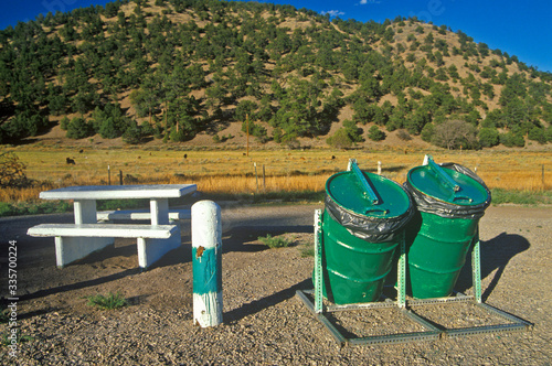 Picnic table with garbage cans at roadside rest area, UT