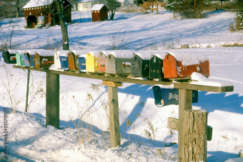 Quadro em tela Row of residential mailboxes in rural, winter setting,  Woodstock, NY