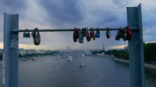 Long shot cityscape of Moscow on a cloudy day with blurred love locks in foreground photo