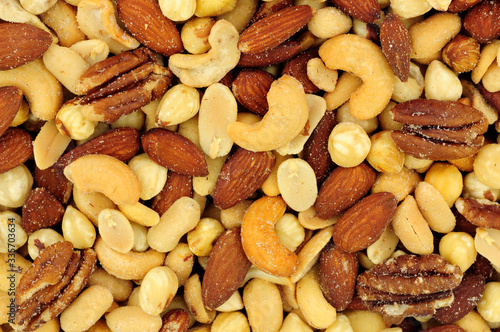 Roasted salted mixed nuts flavourful snacking background