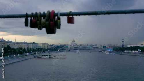 Long shot cityscape of Moscow on a cloudy day with blurred love locks in foreground photo