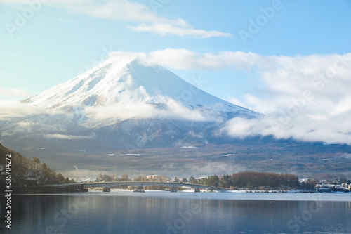 Scenic landscape view of Mt Fuji in the early morning sunrise on the lake kawaguchiko in japan and bridge on winter season