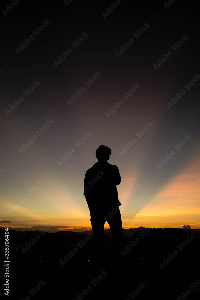 silhouette of a boy on the sunset