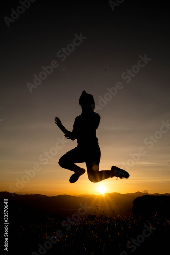 Wallpaper Mural silhouette of a woman jumping Torontodigital.ca