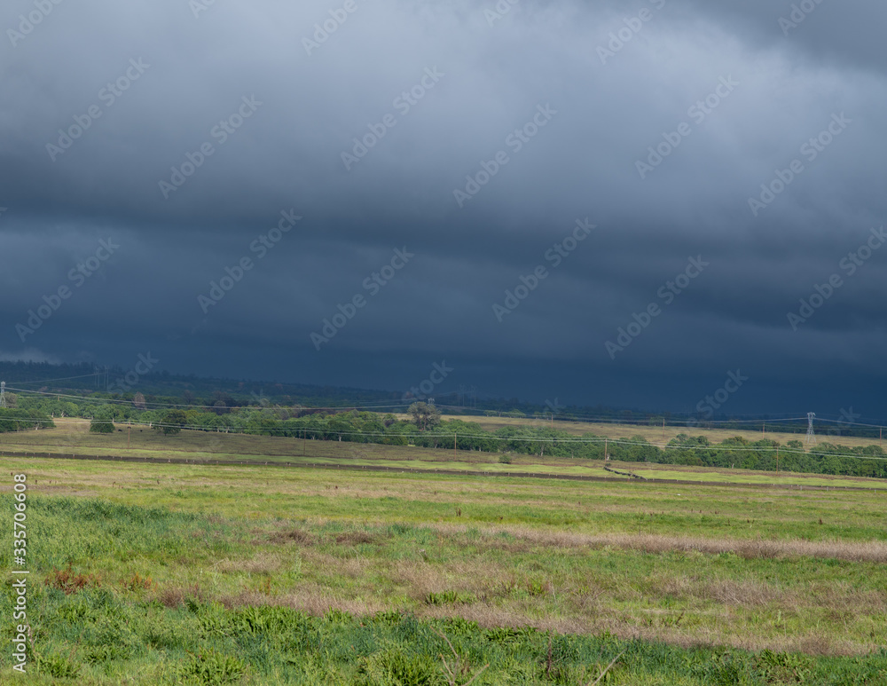 Obraz premium Clouds among the field