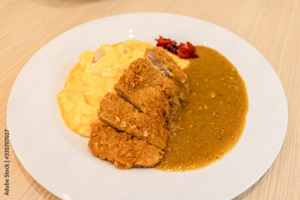 Japanese beef curry rice served on the table in the restaurant. Japanese beef curry rice served on the table in the restaurant.