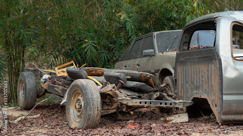 Fotografie Car wreckage that is rusty and very old On outdoor ground