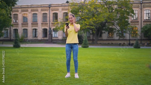 I am lucky! A lucky girl looks at the phone and reads the good news. 4K