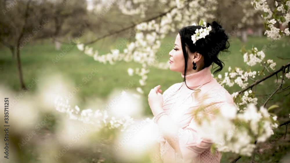 Asian middle aged romantic woman in spring garden