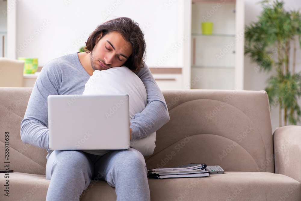 Young male employee freelancer working from home Young male employee freelancer working from home
