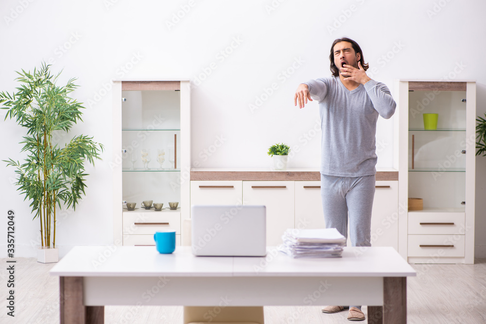 Young male employee freelancer working from home Young male employee freelancer working from home