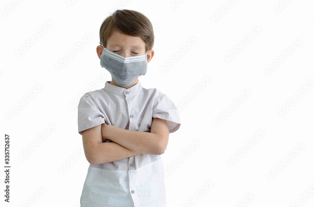 Young caucasian boy wearing a protection mask for prevent Corona virus or air pollution and close his eyes on white background, with clipping path, environmental and healthy concept Young caucasian boy wearing a protection mask for prevent Corona virus or air pollution and close his eyes on white background, with clipping path, environmental and healthy concept