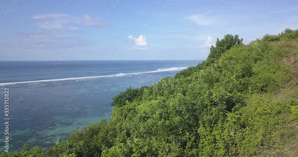 Aerial view of ocean coastline at sunny day, Bali, Indonesia Aerial view of ocean coastline at sunny day, Bali, Indonesia