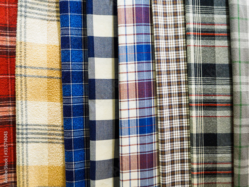 A large selection of bright plaid fabrics in the fabric store. Close-up of cellular tissue samples. Large collection of beautiful fabrics at the factory or in the store