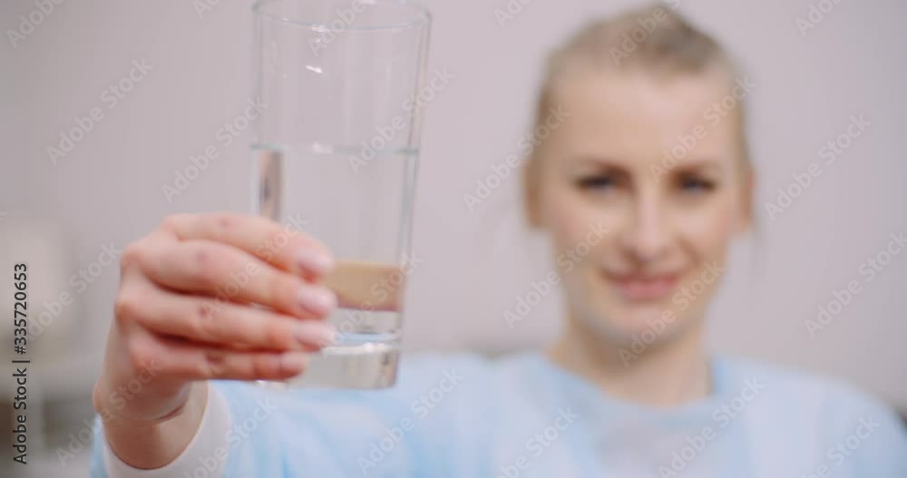 Extreme Close up of Female Doctor Drinking Glass of Water Extreme Close up of Female Doctor Drinking Glass of Water