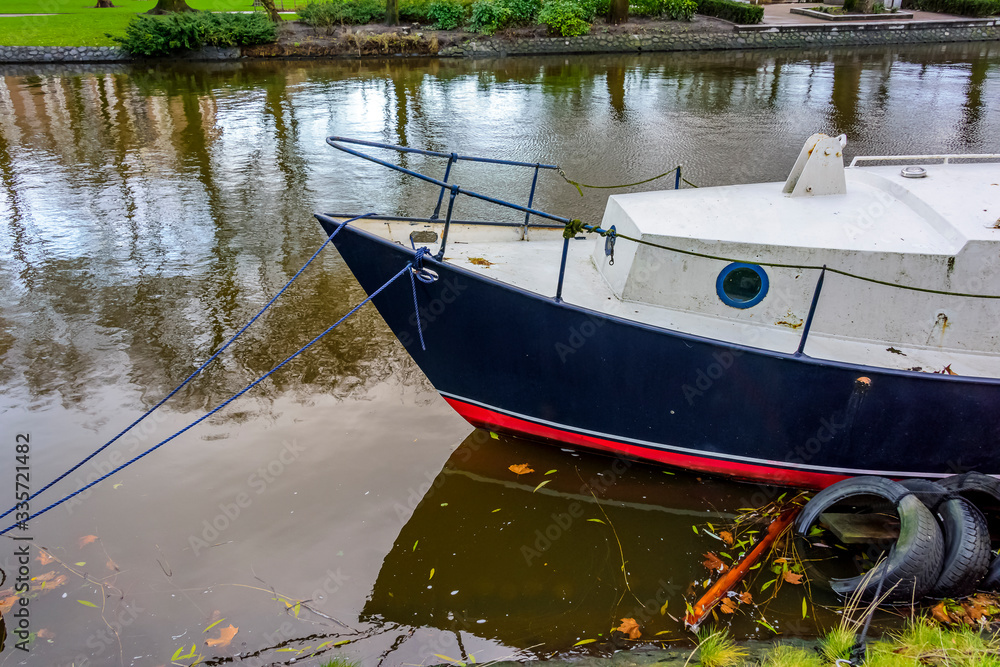 Colorful boats tied up on an Amsterdam canal