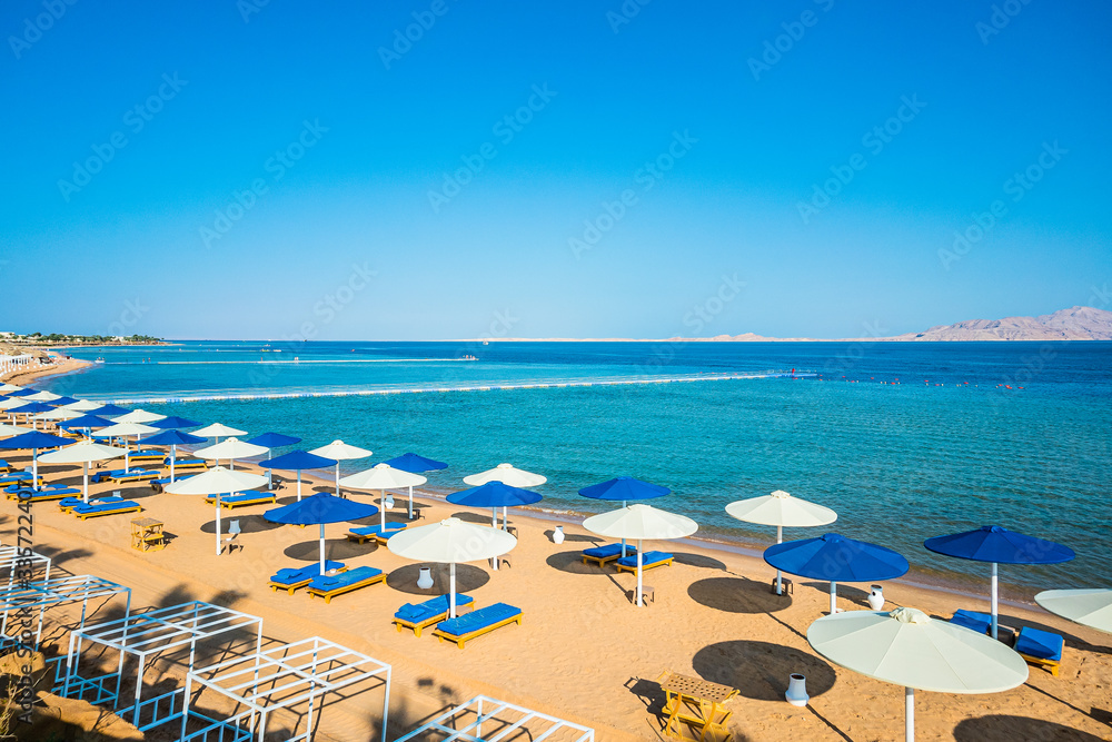 beach umbrellas on the seashore. rest in egypt. The first coastline of the hotel. beach umbrellas on the seashore. rest in egypt. The first coastline of the hotel.