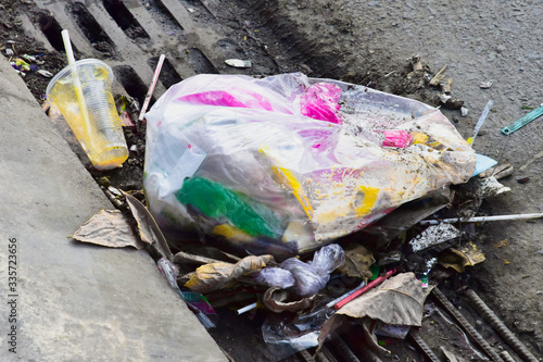 Nha Trang. Vietnam. A pile of garbage on the road in the drainage sewer