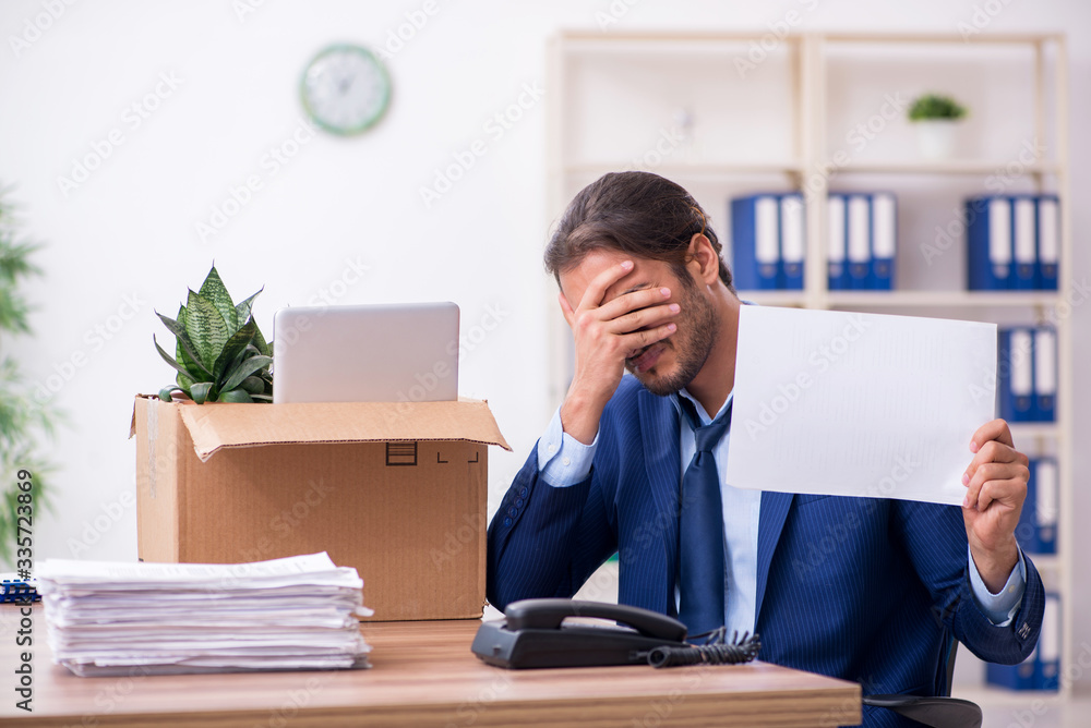 Young man being fired from his work Young man being fired from his work