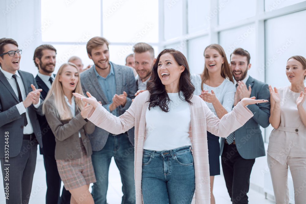 happy woman leader on the background of her business team happy woman leader on the background of her business team