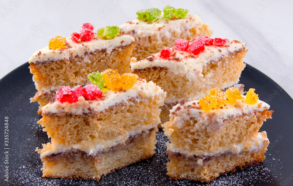 Cake on a black plate close-up