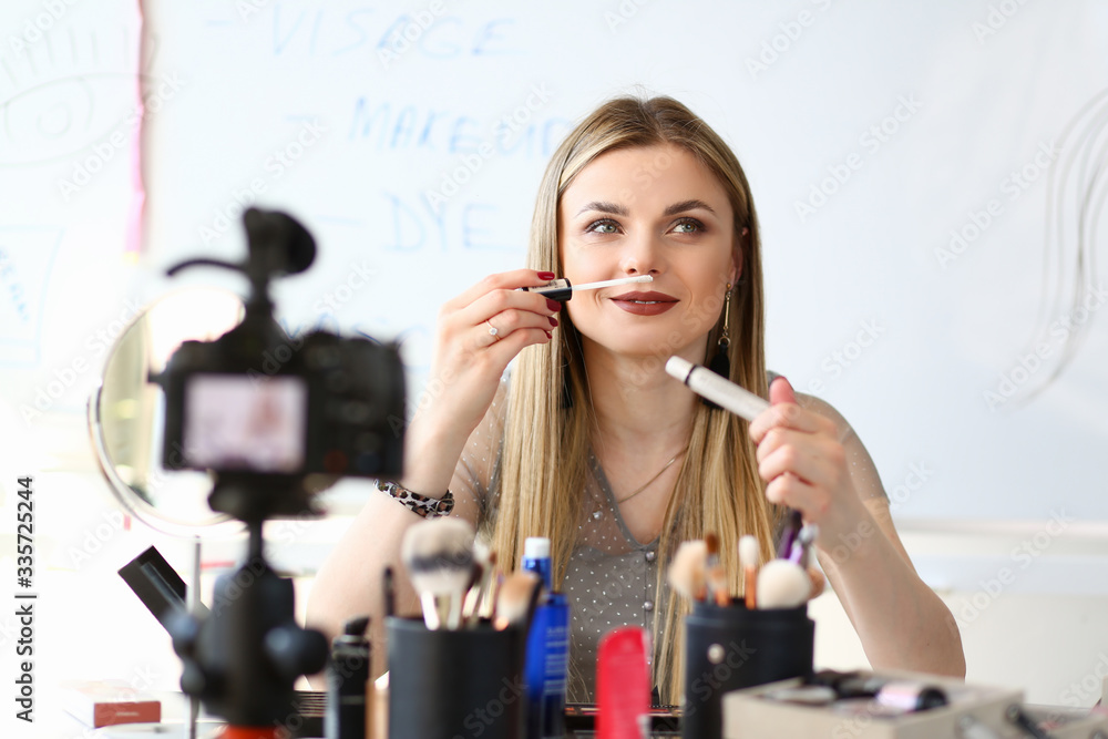 Female Video Blogger Streaming Beauty Tutorial. Social Blogging Business Concept. Caucasian Influencer Girl Holding Concealer, Trying Cosmetics Quality. Visagiste Recording Makeup Vlog