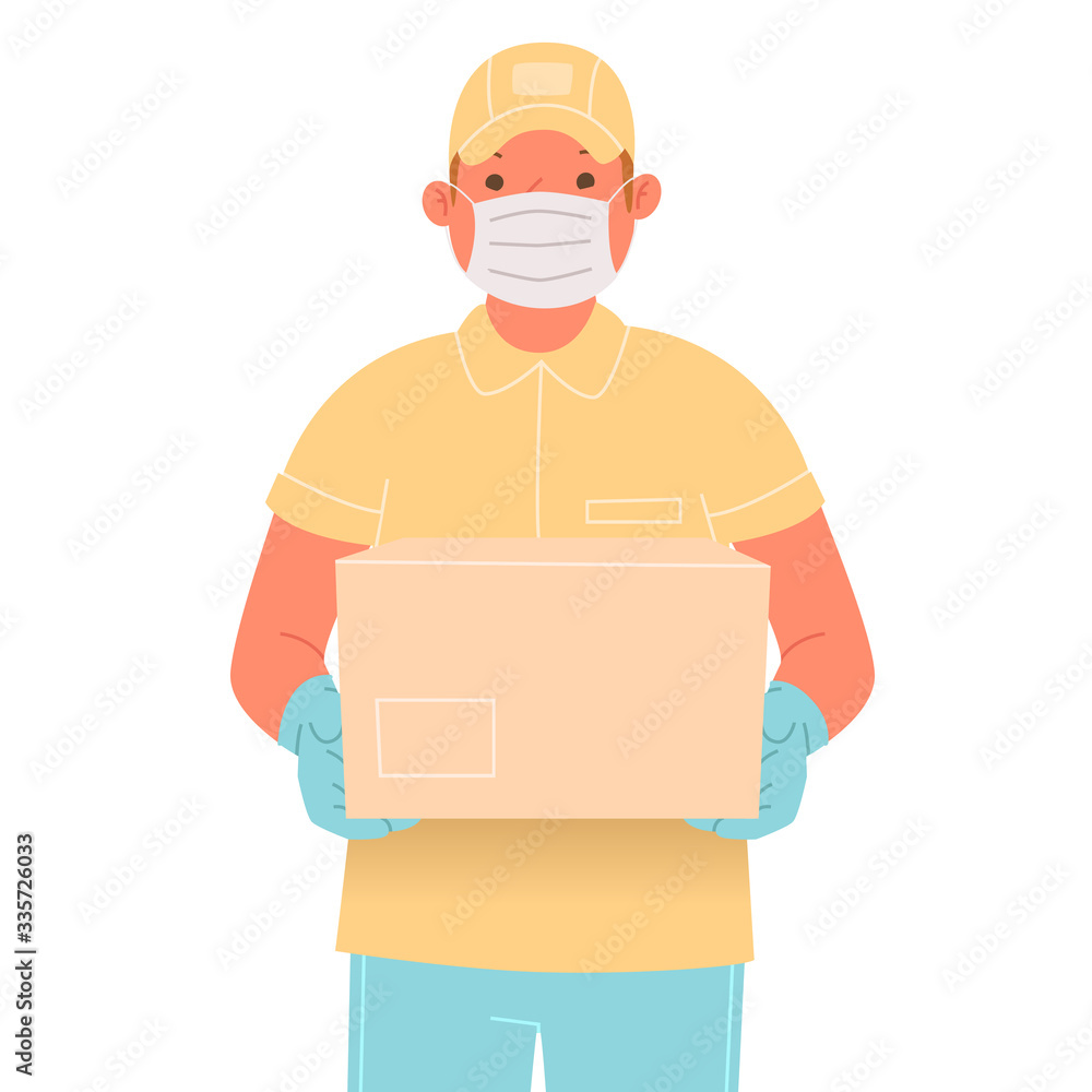 Courier in a medical mask and gloves with a parcel. Delivery service worker during coronavirus outbreak COVID-19 Courier in a medical mask and gloves with a parcel. Delivery service worker during coronavirus outbreak COVID-19