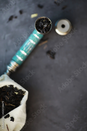 Fototapeta Naklejka Na Ścianę i Meble -  Legalized drugs. Medical prescription smoking drugs. Smoking pipe. A package of narcotic herbs for smoking.