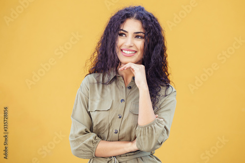 Young Arab Woman with curly hair outdoors