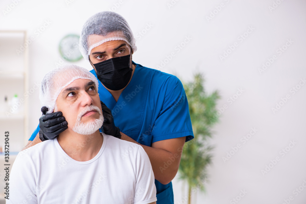 Old man visiting male doctor for plastic surgery Old man visiting male doctor for plastic surgery