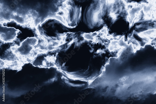 creepy scary face of black thunderclouds in a thunderous sky