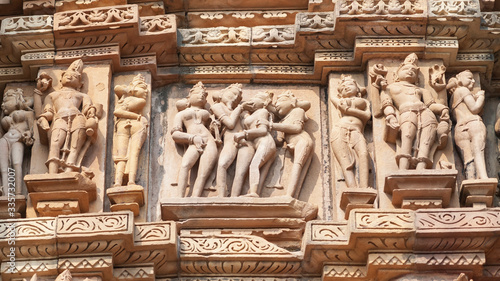 Stone carved erotic bas-relief Sculpture of love making in Kandariya Mahadeva Temple, Khajuraho Group of Monuments, India