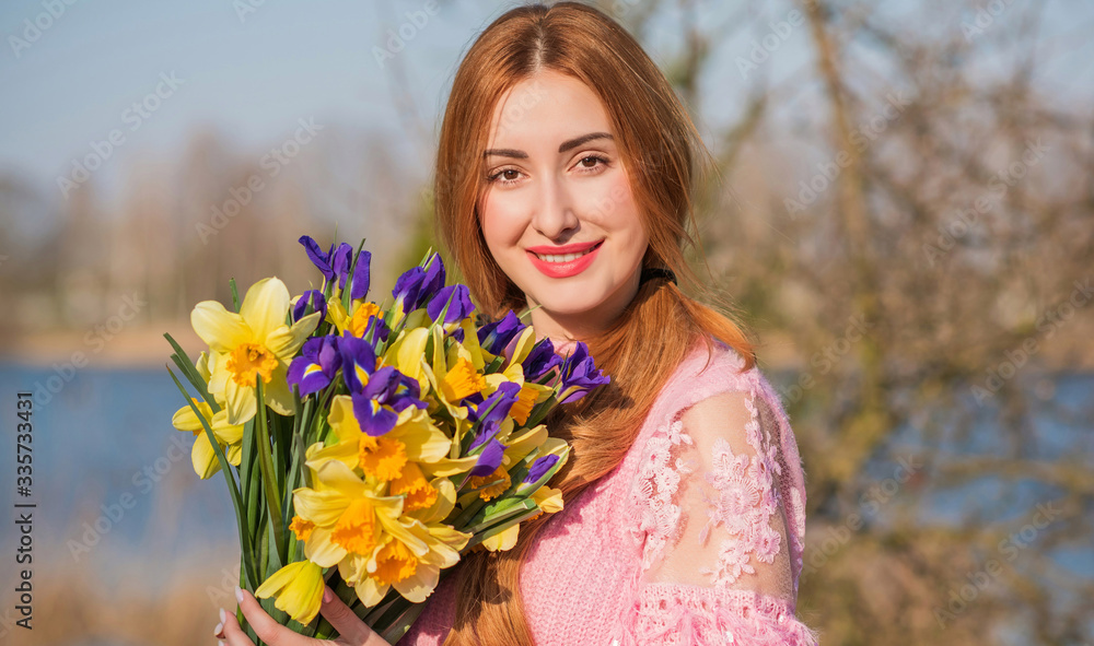 Naklejka premium Spring magic, woman with bouquet of flowers 