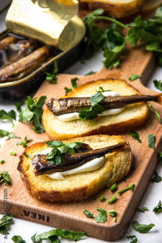 sandwiches with sprats and herbs