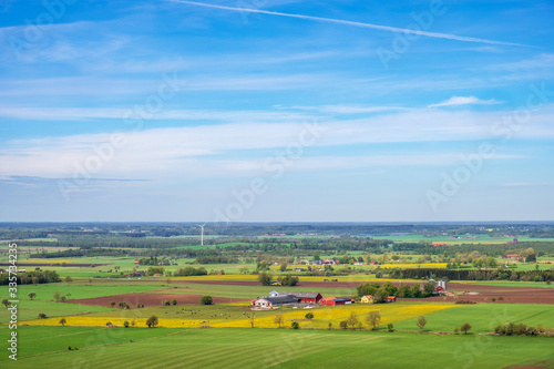 Beautiful aerial view at a patchwork landscape with farms and fields