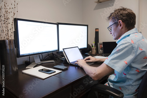 Middle aged man working from home from his home office