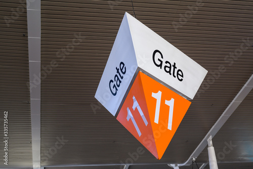 Aiport fight departure big gate sign in orange colors photo